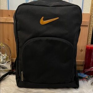 Nike Black Backpack with Gold Swoosh Accent